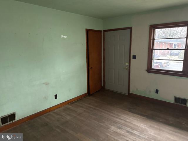 2441 Alder Street Norfolk, VA 23513 - Photo 5 of 11 an empty room with windows