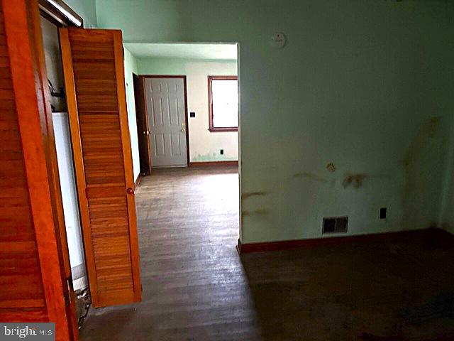 2441 Alder Street Norfolk, VA 23513 - Photo 6 of 11 an empty room with wooden floor and windows