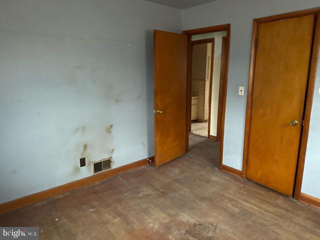 2441 Alder Street Norfolk, VA 23513 - Photo 10 of 11 an empty room with windows