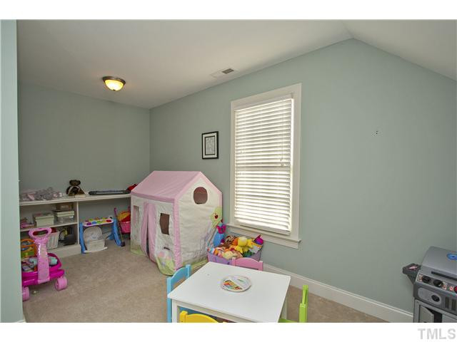 8717 Oregon Inlet Court Raleigh, NC 27603 - Photo 19 of 25 Another image of bonus - notice the built in desk in the back. Great space for homework or adult get-away! Holes pre-cut for running cords! Bonus Room