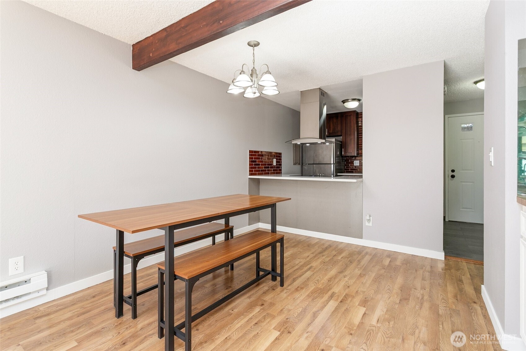 1802 Maple Lane, Unit A5 Kent, WA 98030 - Photo 8 of 27 a view of a room with wooden floor and chandelier