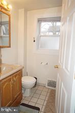 949 Fairview Avenue Wayne, PA 19087 - Photo 10 of 11 a bathroom with a toilet a sink and a window
