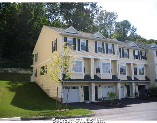 Exterior Front. Private end unit with many upgraded features.