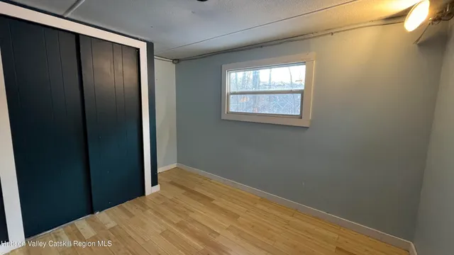 a bed room with a bed and a window