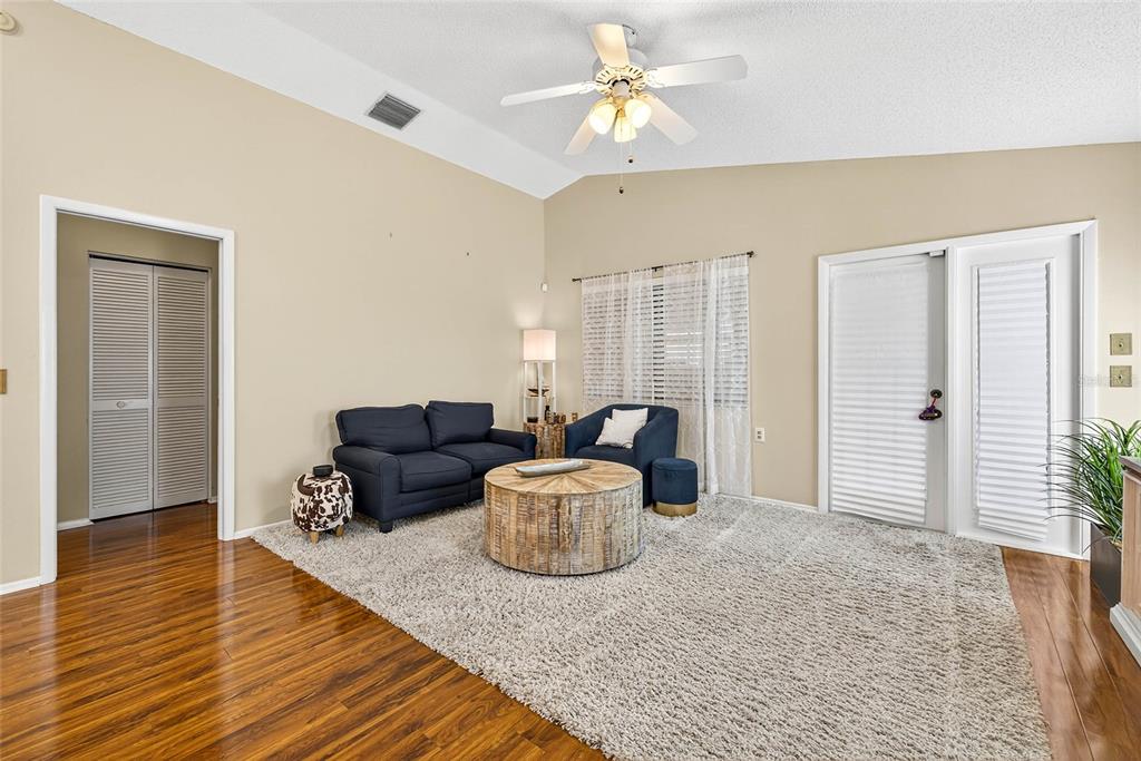 4658 Wallingford Court New Port Richey, FL 34655 - Photo 8 of 48 a living room with furniture and wooden floor