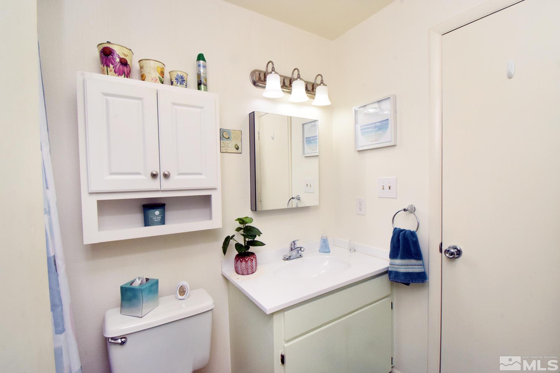 1848 Matteoni Drive Sparks, NV 89434 - Photo 11 of 34 a bathroom with a sink and a mirror