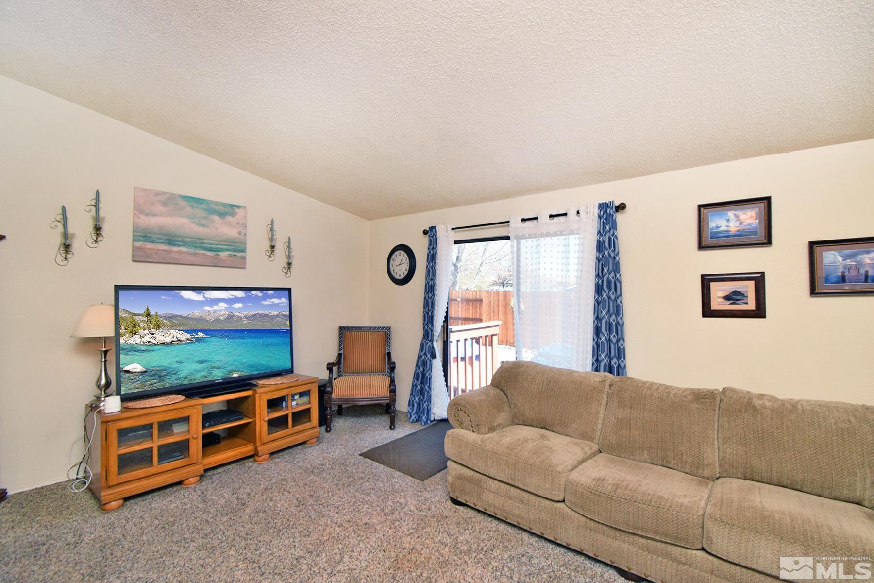 1848 Matteoni Drive Sparks, NV 89434 - Photo 18 of 34 a living room with furniture and a flat screen tv