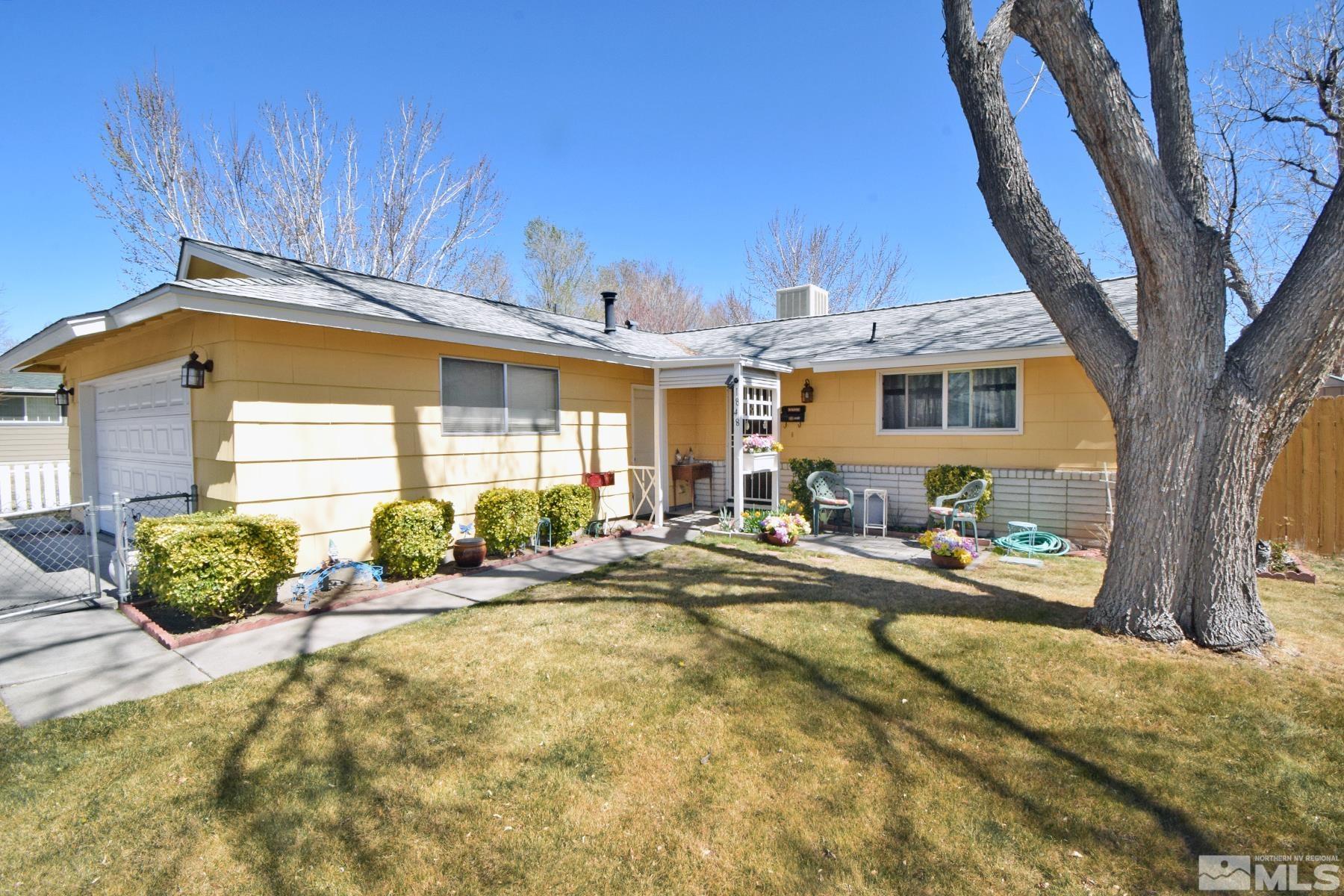 1848 Matteoni Drive Sparks, NV 89434 - Photo 2 of 34 a front view of a house with basket ball court and outdoor seating