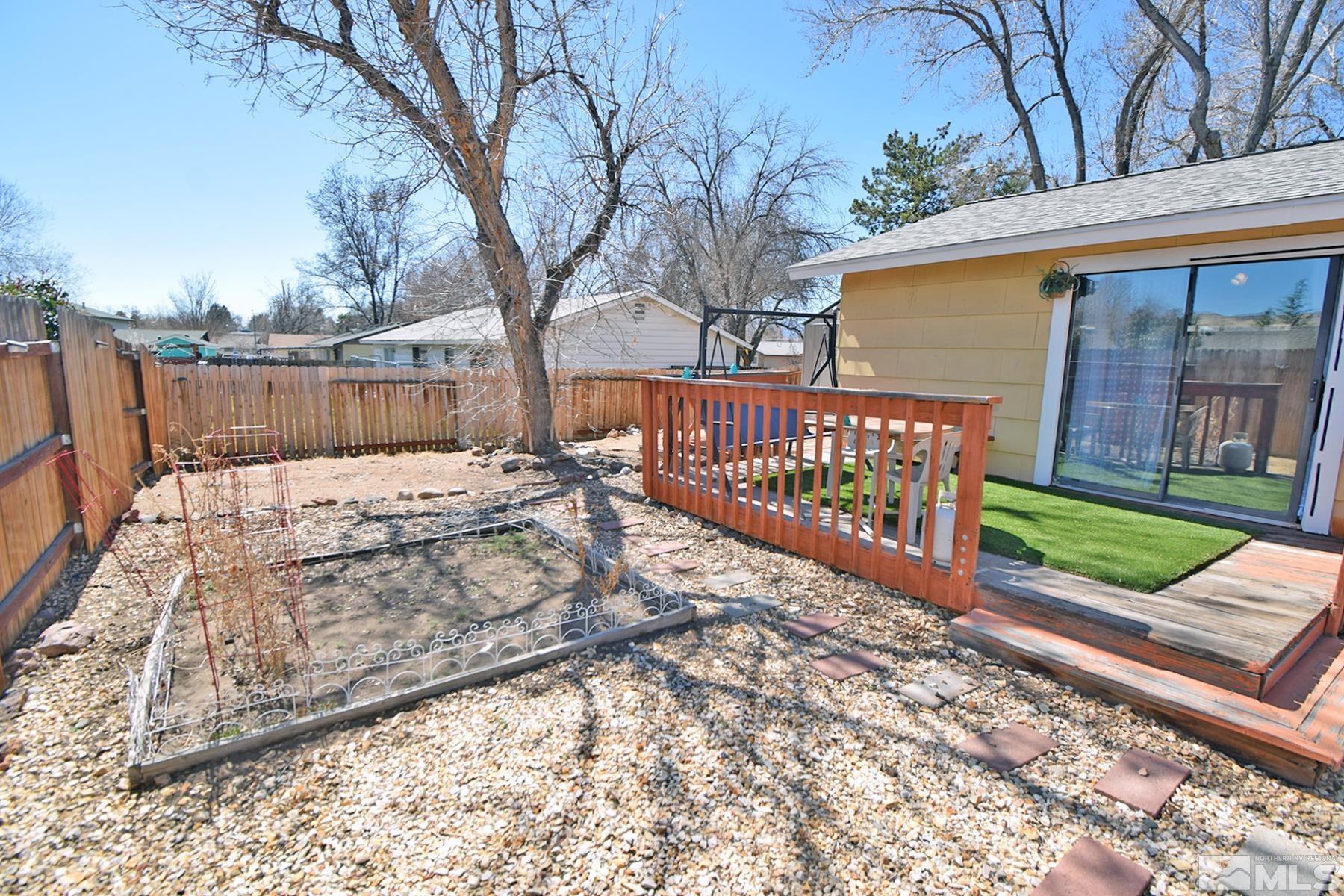 1848 Matteoni Drive Sparks, NV 89434 - Photo 22 of 34 a view of a bench with wooden fence