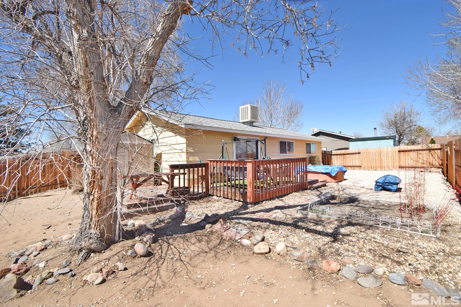 1848 Matteoni Drive Sparks, NV 89434 - Photo 23 of 34 a view of a house with a large tree