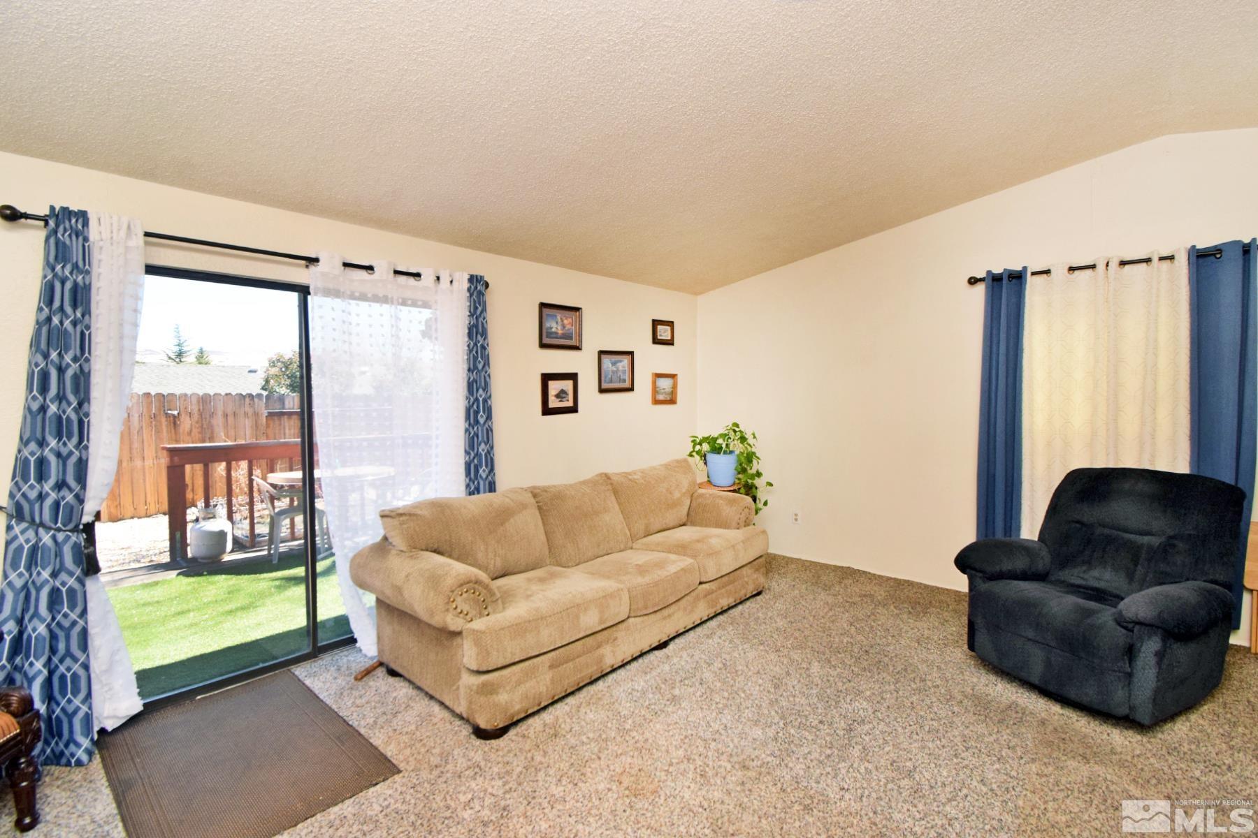 1848 Matteoni Drive Sparks, NV 89434 - Photo 4 of 34 a living room with furniture and a large window