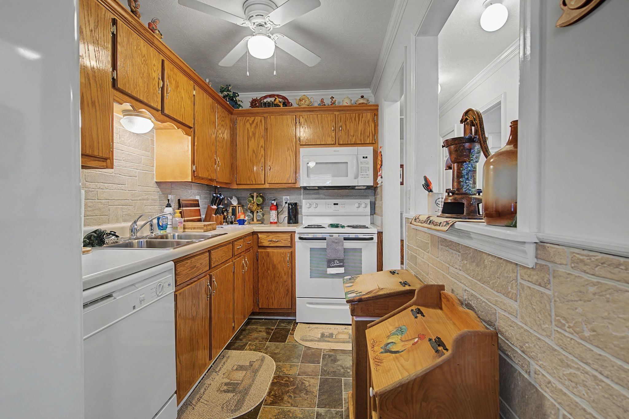 1075 Coker Ford Road Portland, TN 37148 - Photo 17 of 35 a kitchen with a stove cabinets and a sink