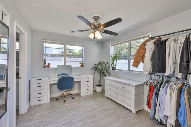 wooden floor in an empty room with a bathroom
