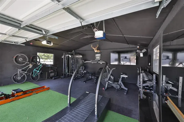 an aerial view of multiple houses with yard