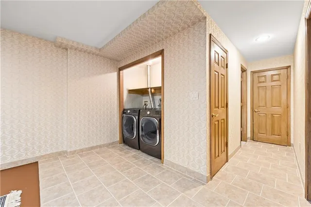 a view of a chandelier fan and fire place