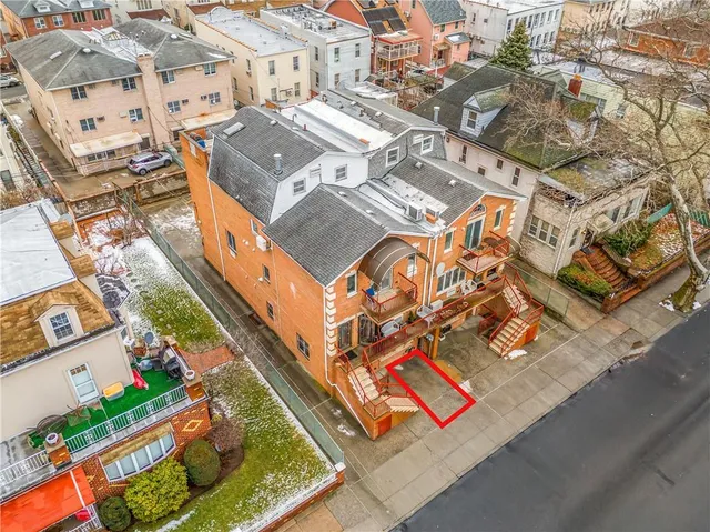 an aerial view of a building with garden