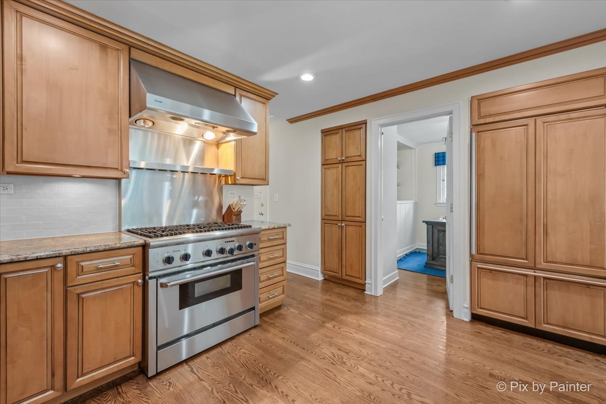705 Hunter Road Glenview, IL 60025 - Photo 14 of 51 a kitchen with a stove and a refrigerator