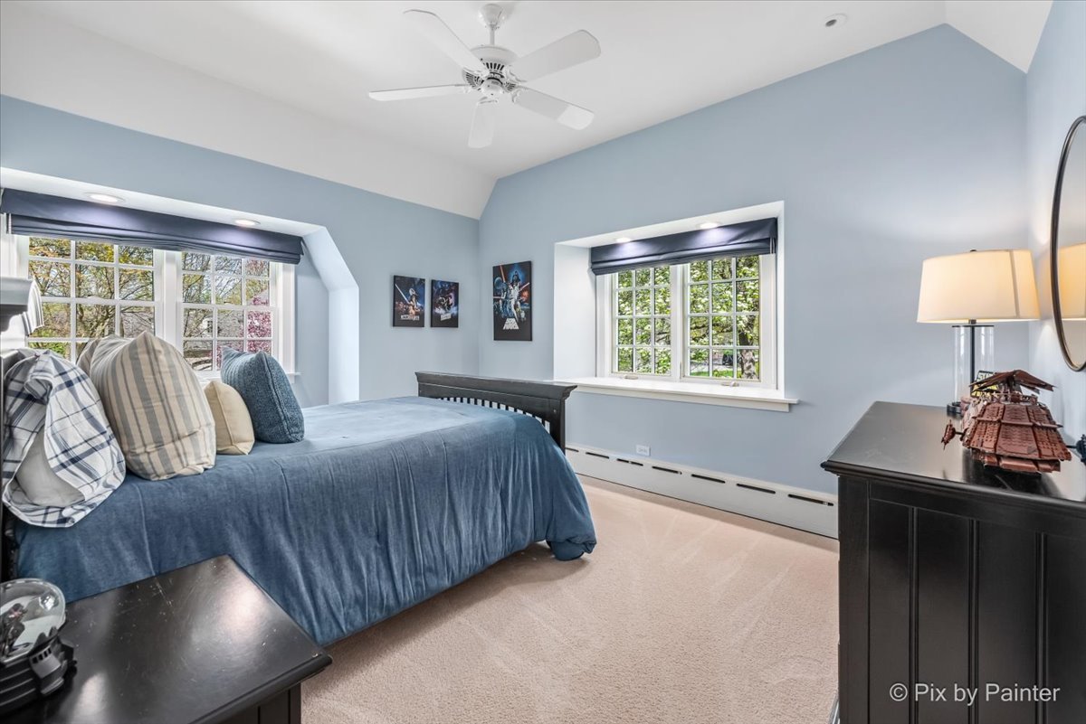 705 Hunter Road Glenview, IL 60025 - Photo 20 of 51 a bedroom with a bed and a window