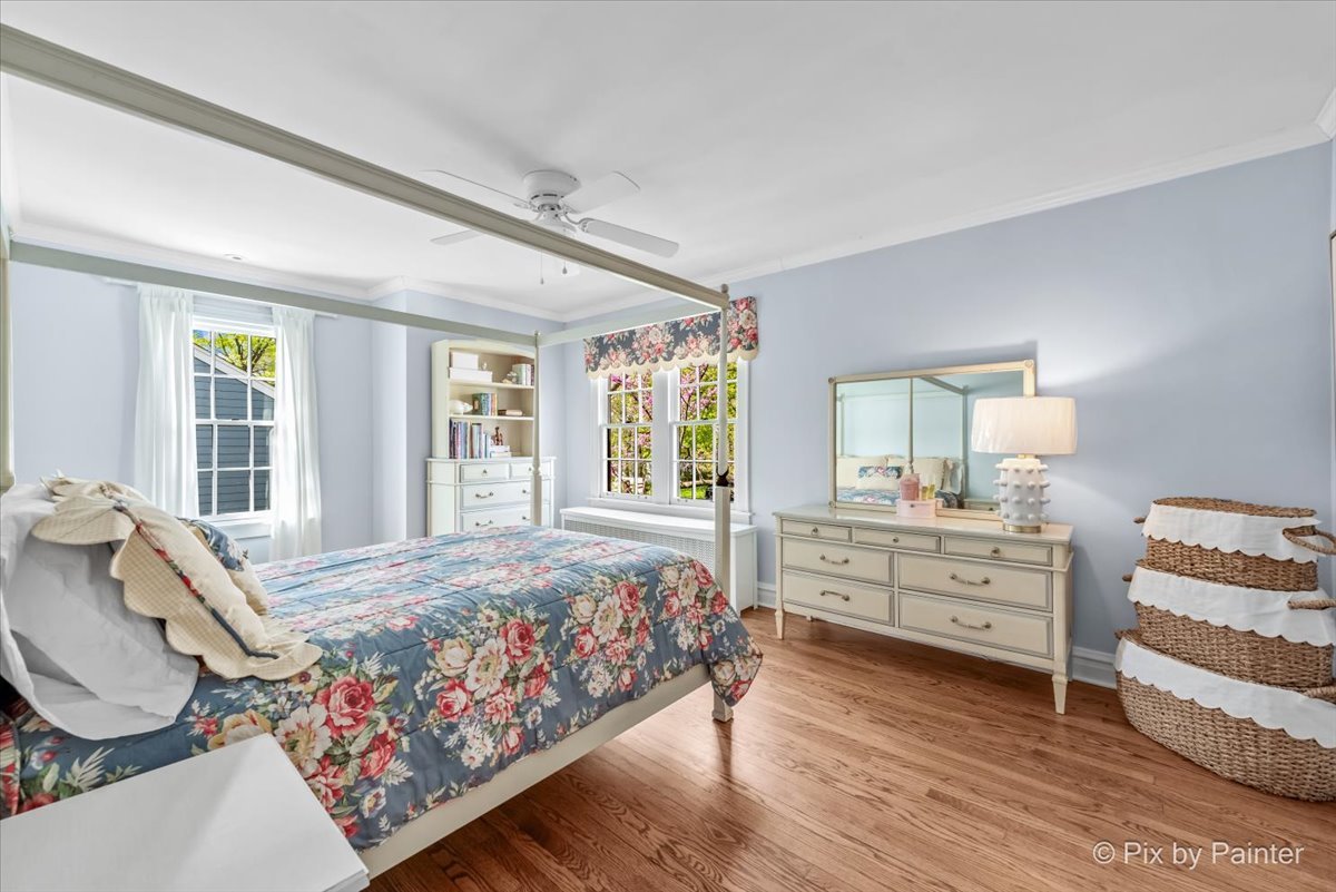 705 Hunter Road Glenview, IL 60025 - Photo 21 of 51 a bedroom with a bed and large windows