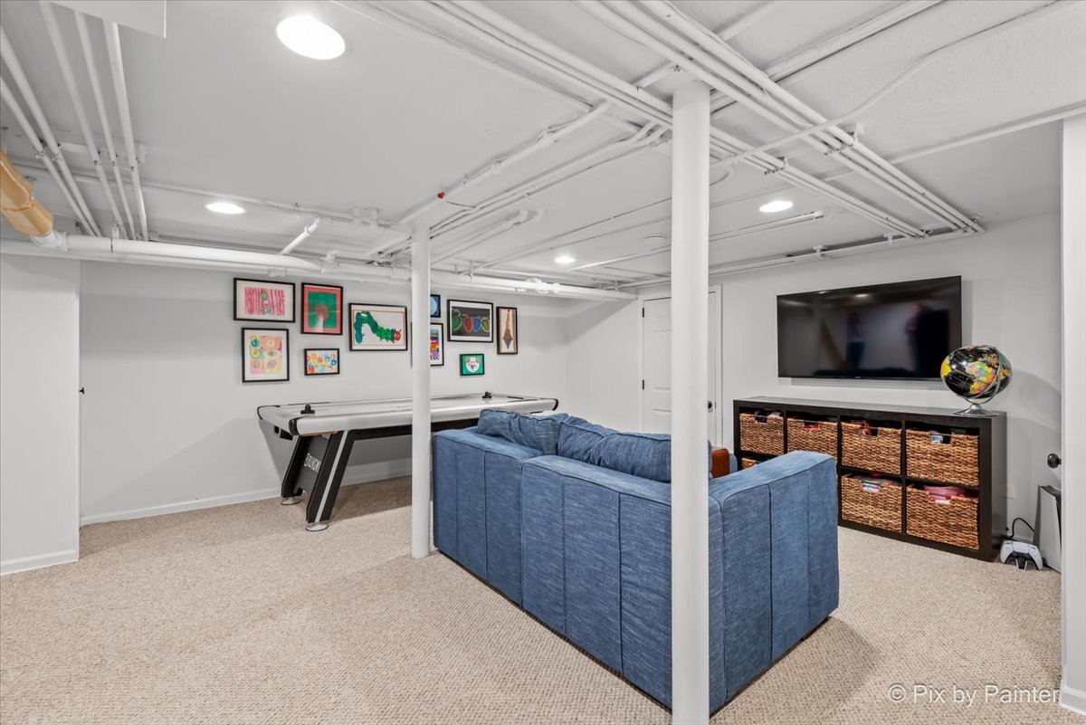 705 Hunter Road Glenview, IL 60025 - Photo 26 of 51 a living room with furniture and a flat screen tv