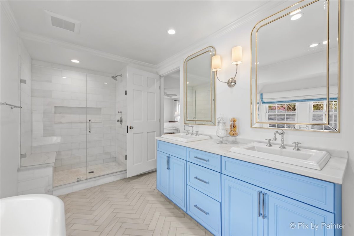 705 Hunter Road Glenview, IL 60025 - Photo 3 of 51 a spacious bathroom with 2 sink tub and shower