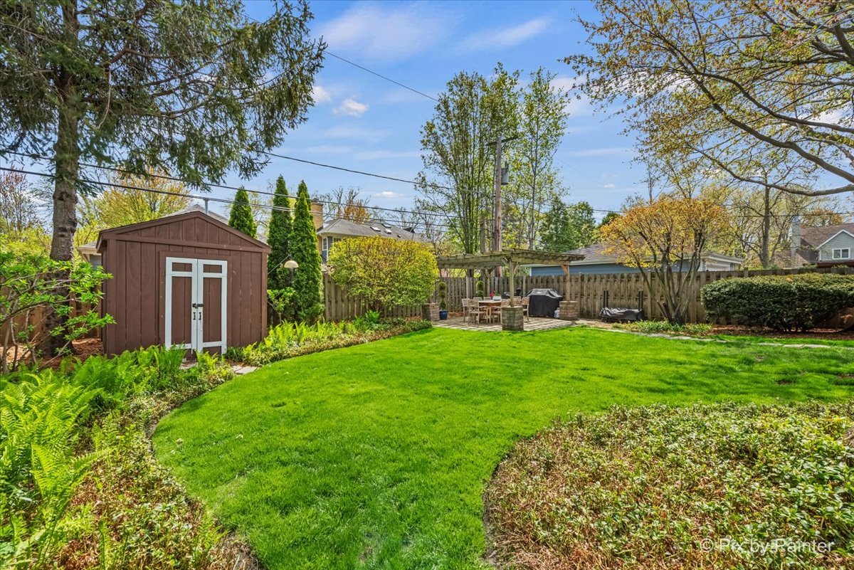 705 Hunter Road Glenview, IL 60025 - Photo 31 of 51 a view of a house with a backyard