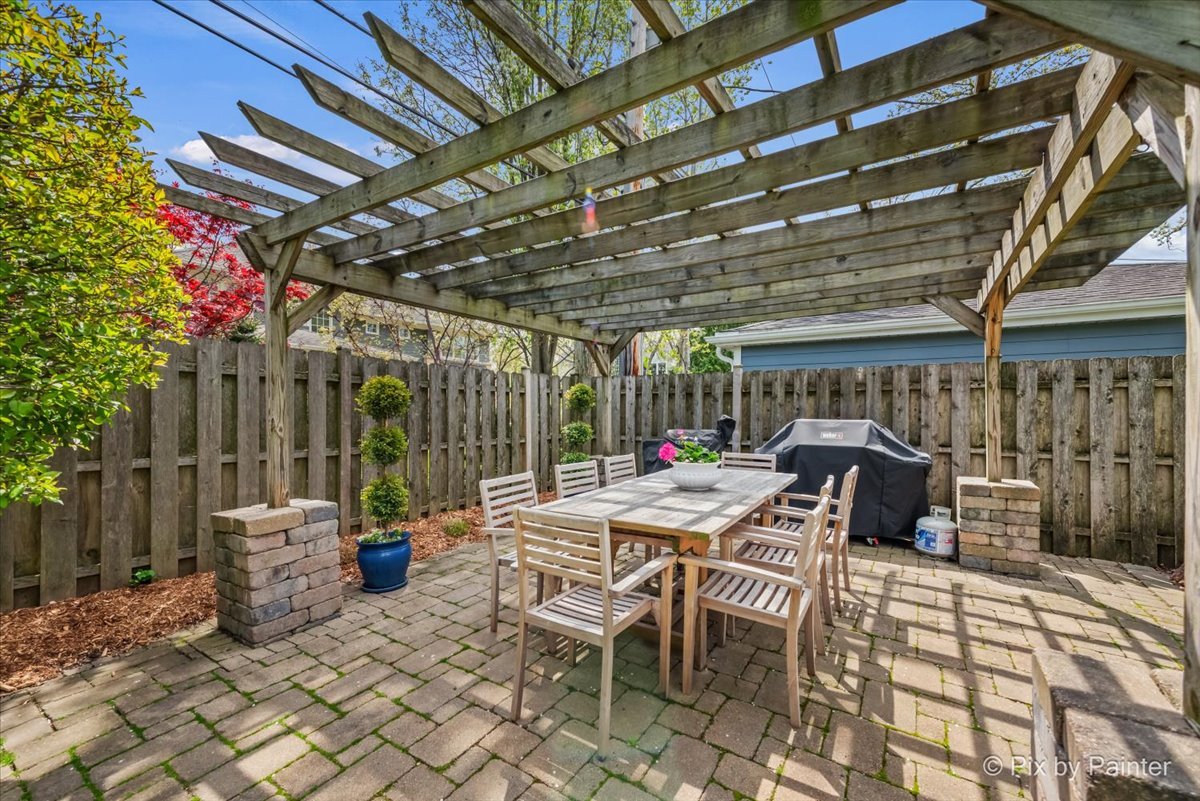 705 Hunter Road Glenview, IL 60025 - Photo 32 of 51 a view of a patio with a table and chairs