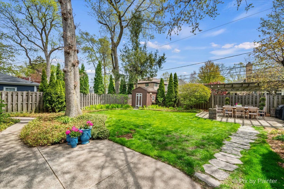 705 Hunter Road Glenview, IL 60025 - Photo 33 of 51 a view of a backyard with sitting area