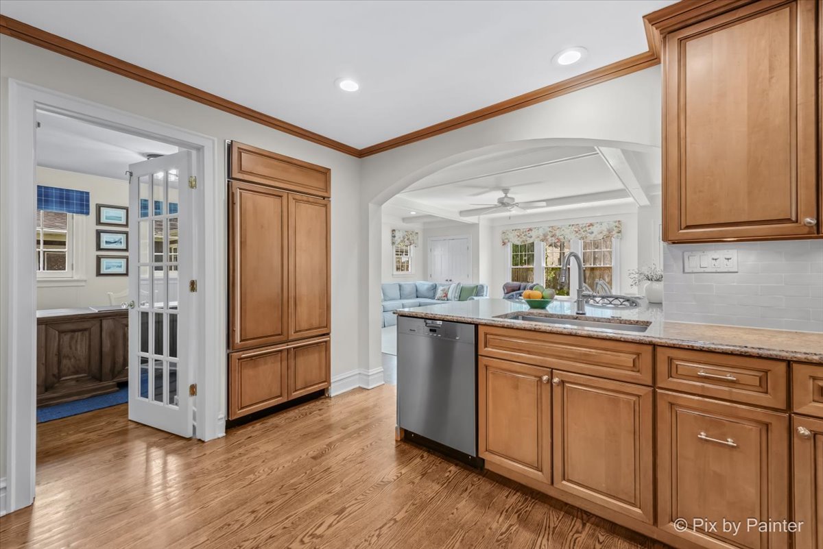 705 Hunter Road Glenview, IL 60025 - Photo 4 of 51 a kitchen with stainless steel appliances granite countertop a refrigerator and a sink