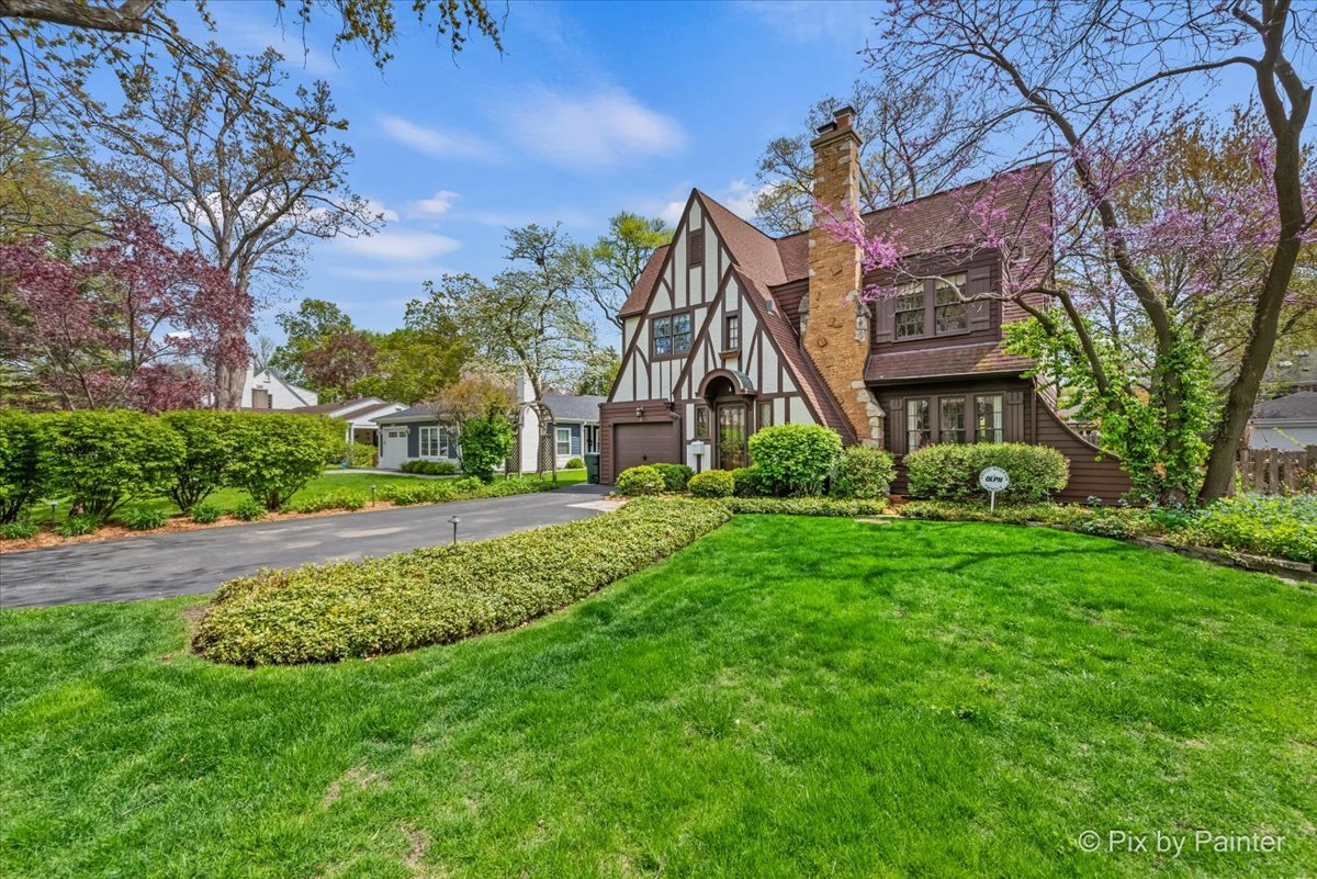 705 Hunter Road Glenview, IL 60025 - Photo 51 of 51 front view of a house with a big yard and a large tree