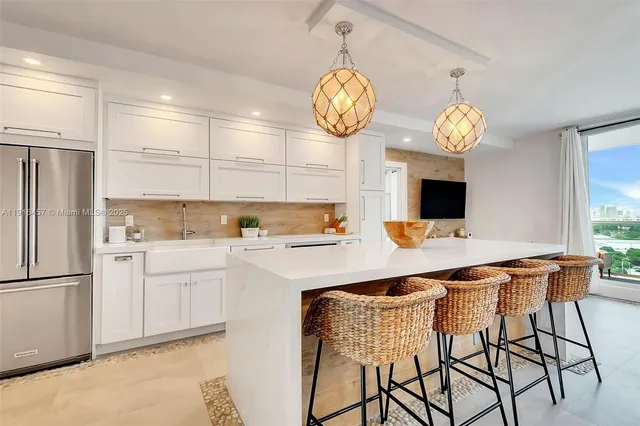 a kitchen with a table and chairs in it
