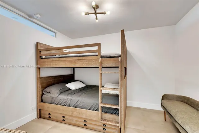 a bedroom with a bed and lamp