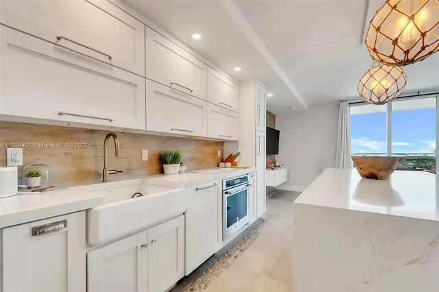 a kitchen with a sink cabinets and window