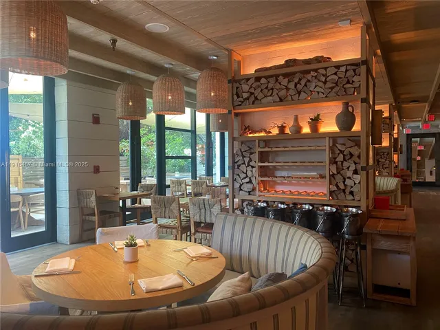 a view of living room with patio furniture and a chandelier
