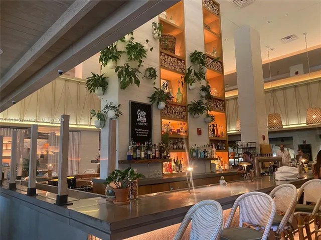 a view of a swimming pool with chairs