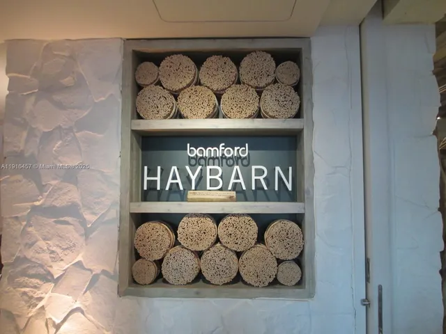 a living room with furniture a wooden floor and a window