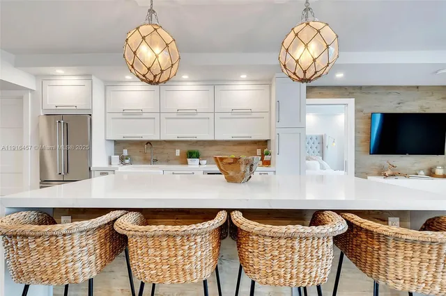 a view of dining room and kitchen with furniture and wooden floor