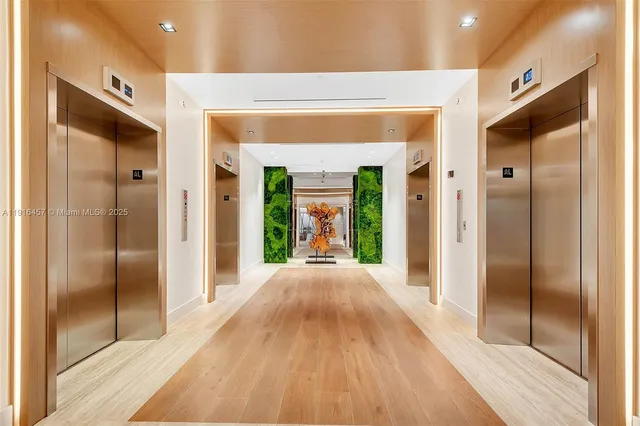 a bedroom with furniture and a large window