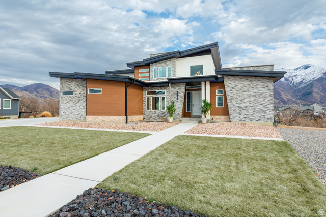 262 North Santa Fe Drive Mapleton, UT 84664 - Photo 1 of 28 Contemporary home with a mountain view, stone siding, and a front lawn