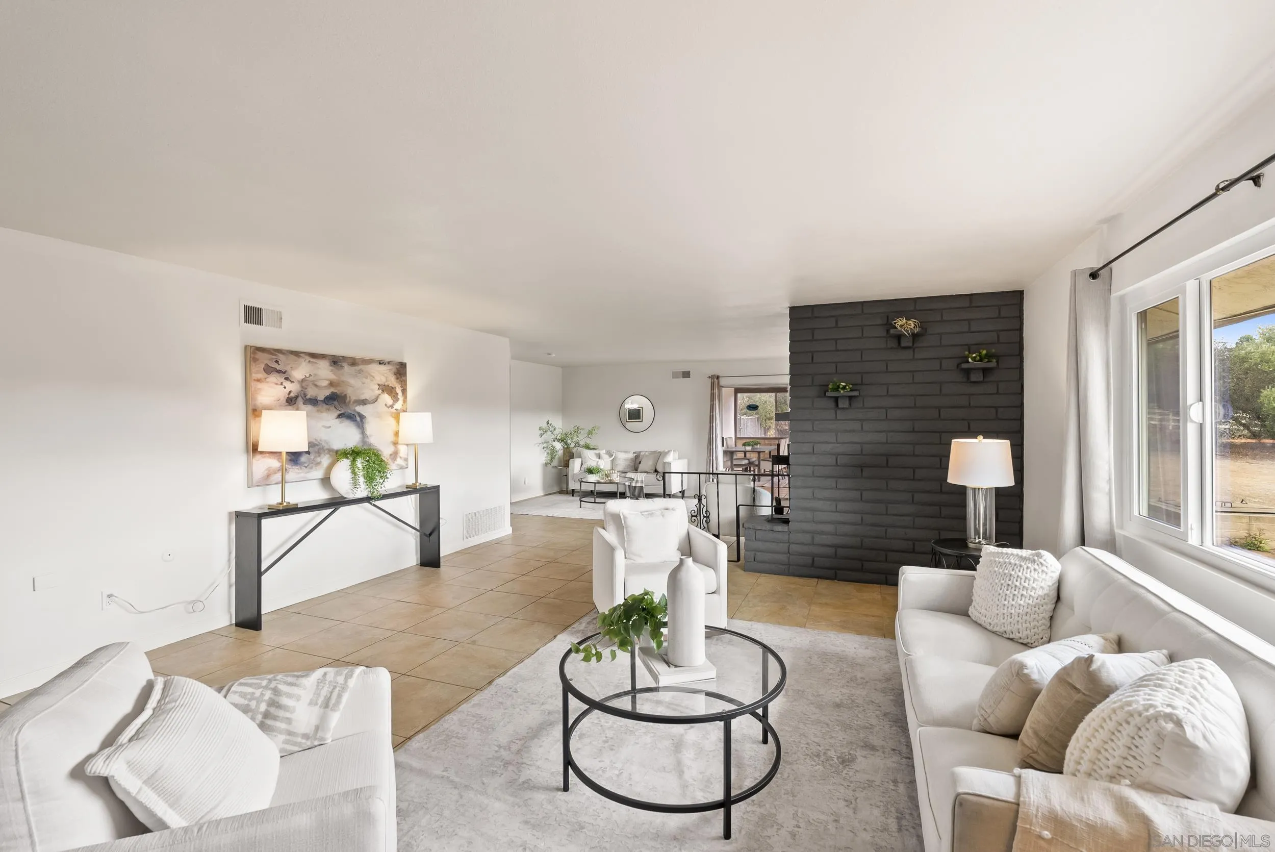 1429 Midway Drive Alpine, CA 91901 - Photo 15 of 42 a living room with furniture a dining table and a large window
