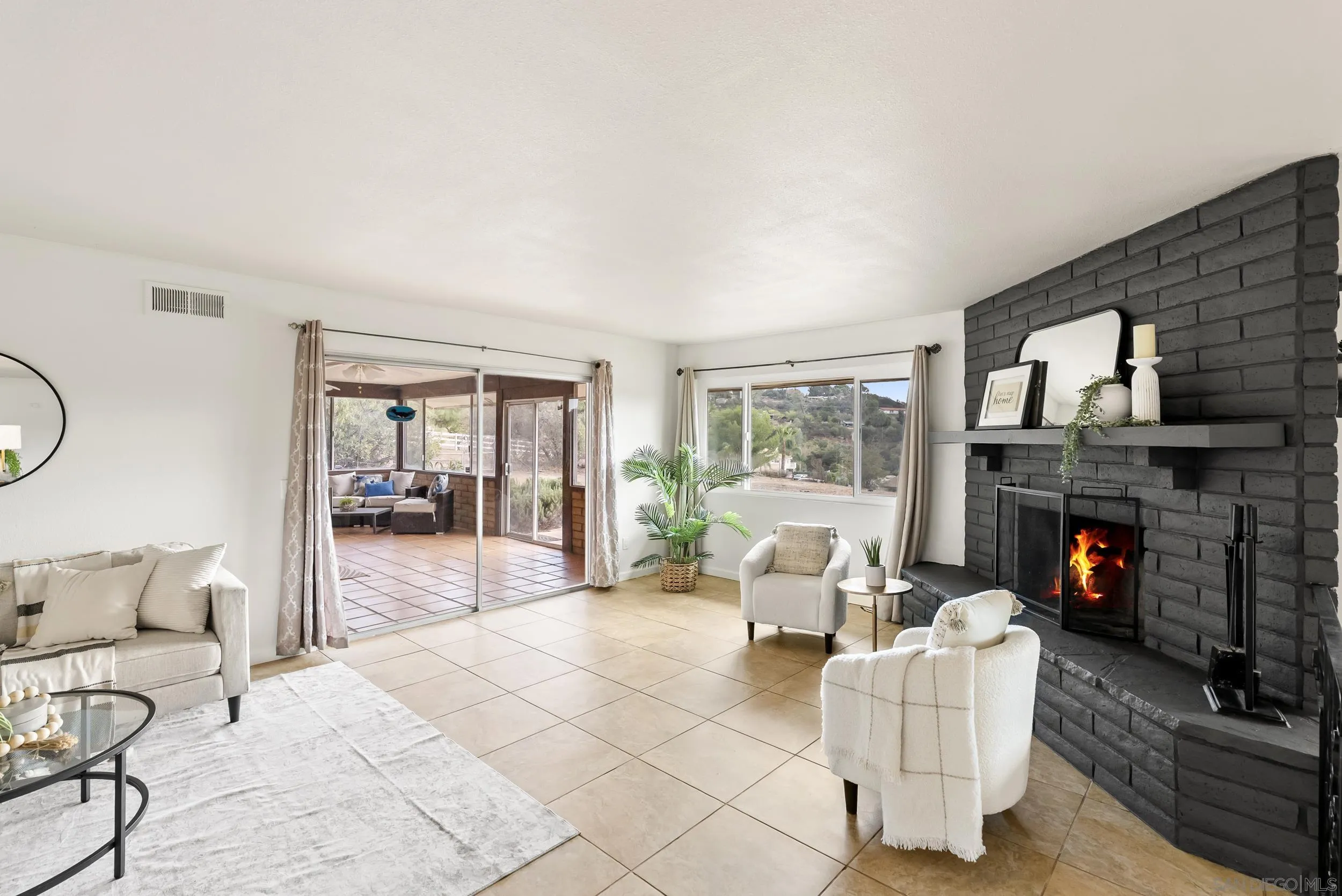 1429 Midway Drive Alpine, CA 91901 - Photo 17 of 42 a living room with furniture and a fireplace
