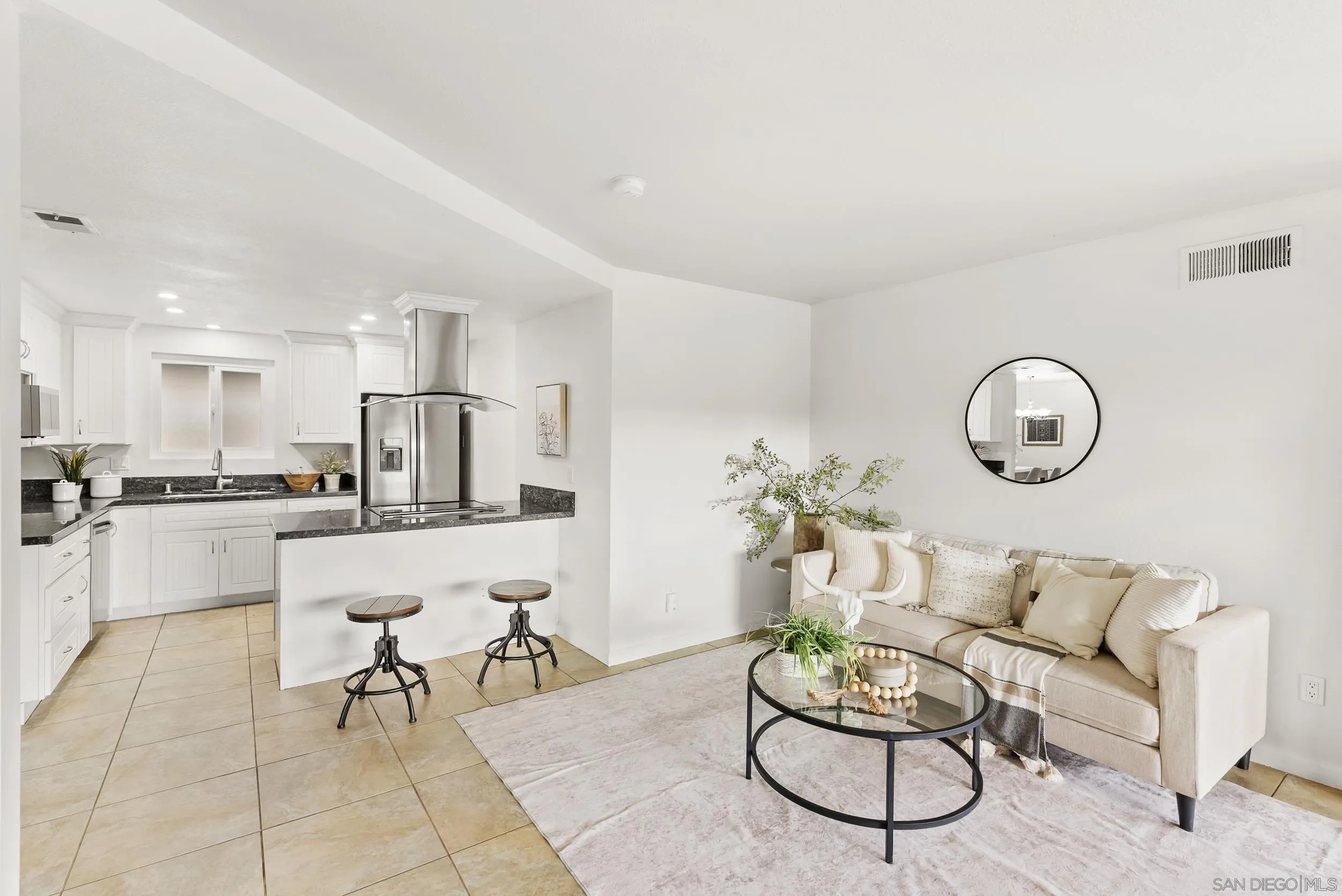 1429 Midway Drive Alpine, CA 91901 - Photo 18 of 42 a living room with furniture a refrigerator and kitchen view