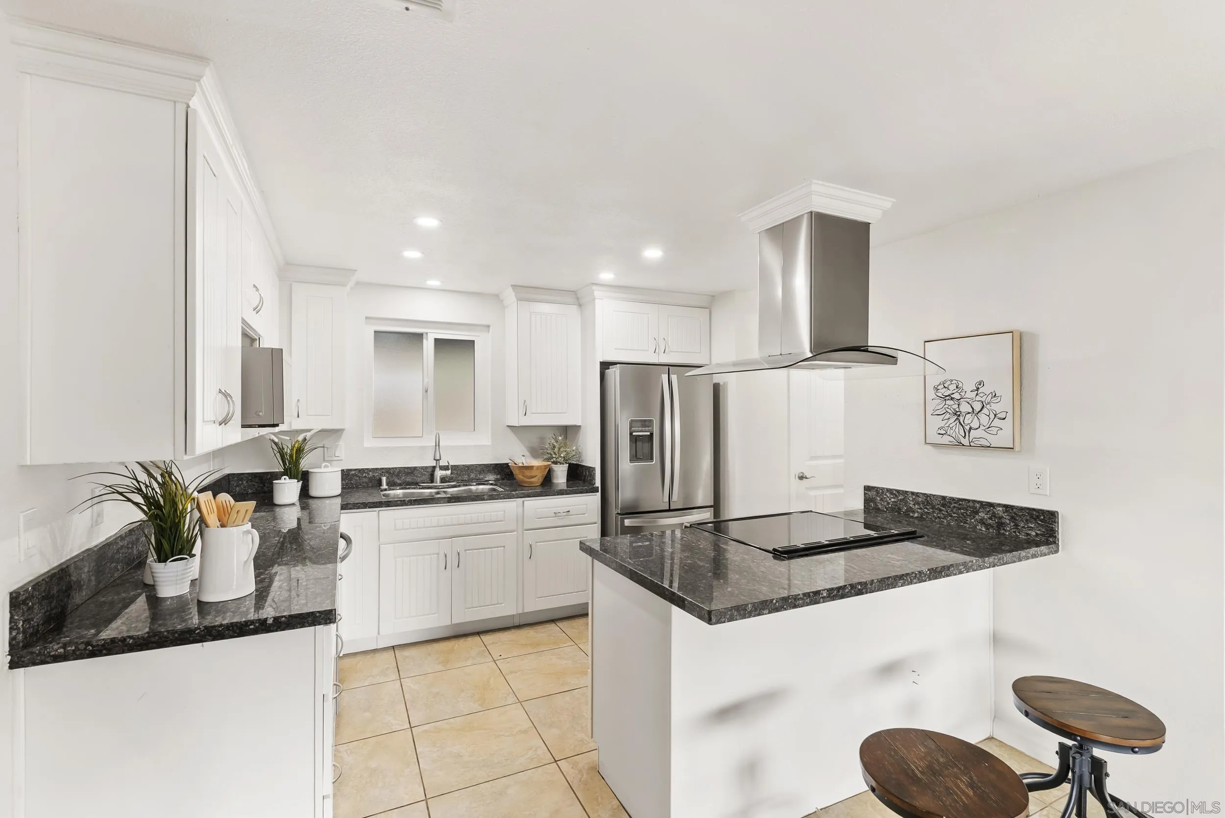 1429 Midway Drive Alpine, CA 91901 - Photo 20 of 42 a kitchen with stainless steel appliances granite countertop a sink stove and refrigerator