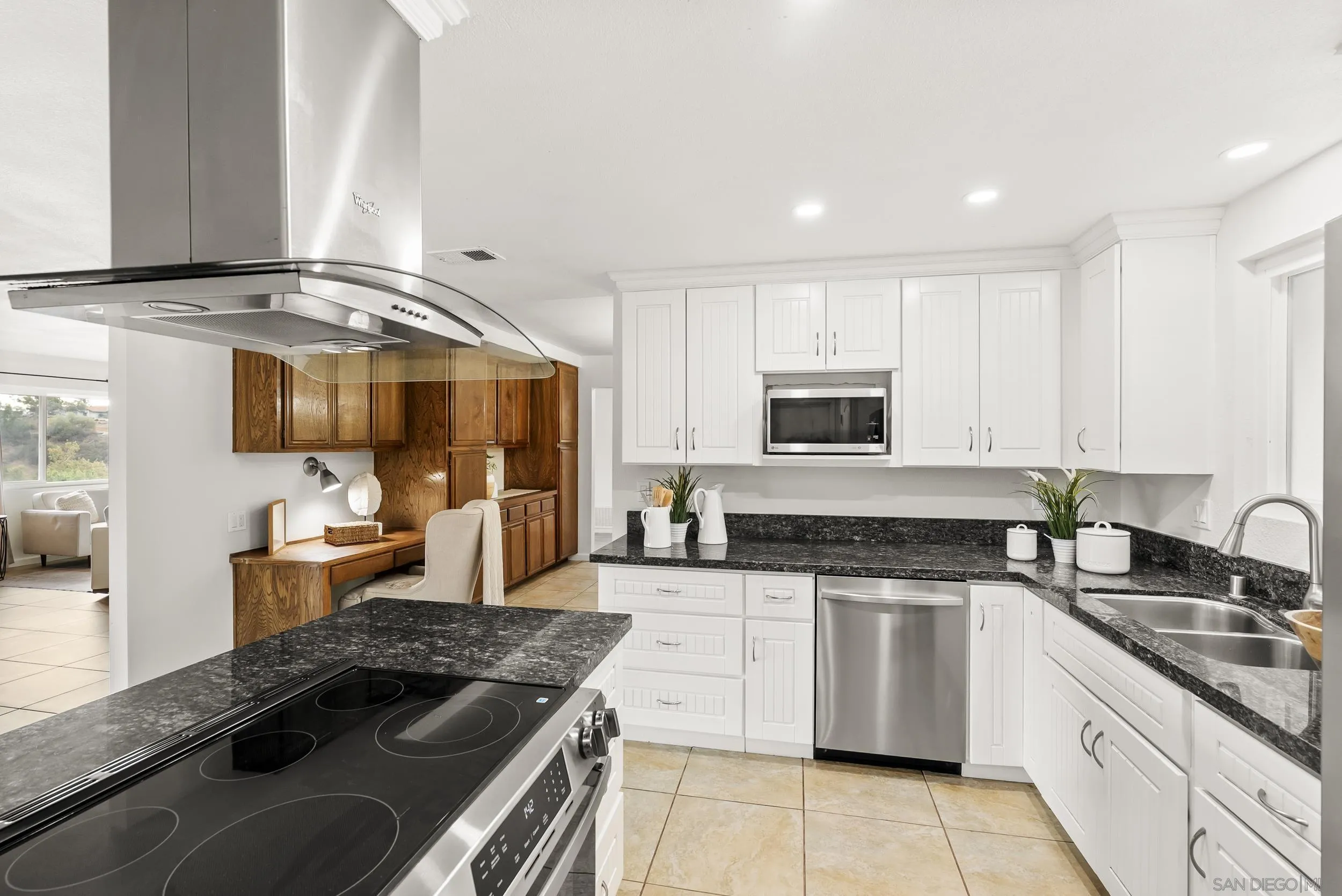 1429 Midway Drive Alpine, CA 91901 - Photo 21 of 42 a kitchen with stainless steel appliances granite countertop a sink stove and cabinets