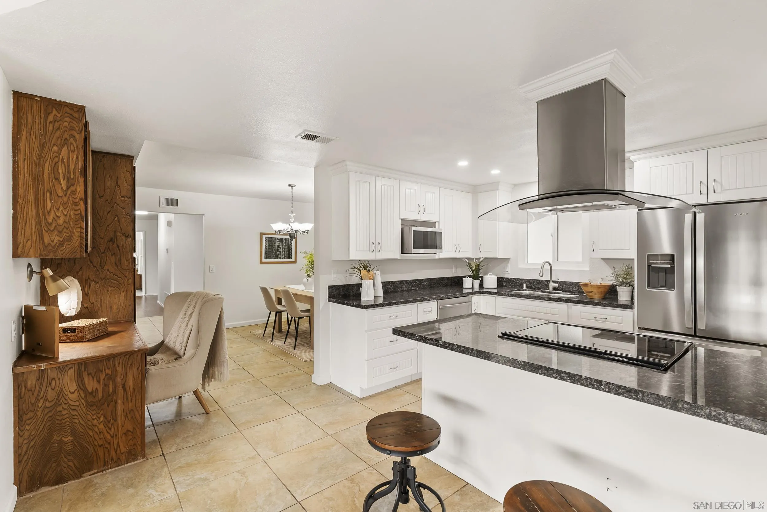 1429 Midway Drive Alpine, CA 91901 - Photo 22 of 42 a kitchen with stainless steel appliances granite countertop a sink and a refrigerator
