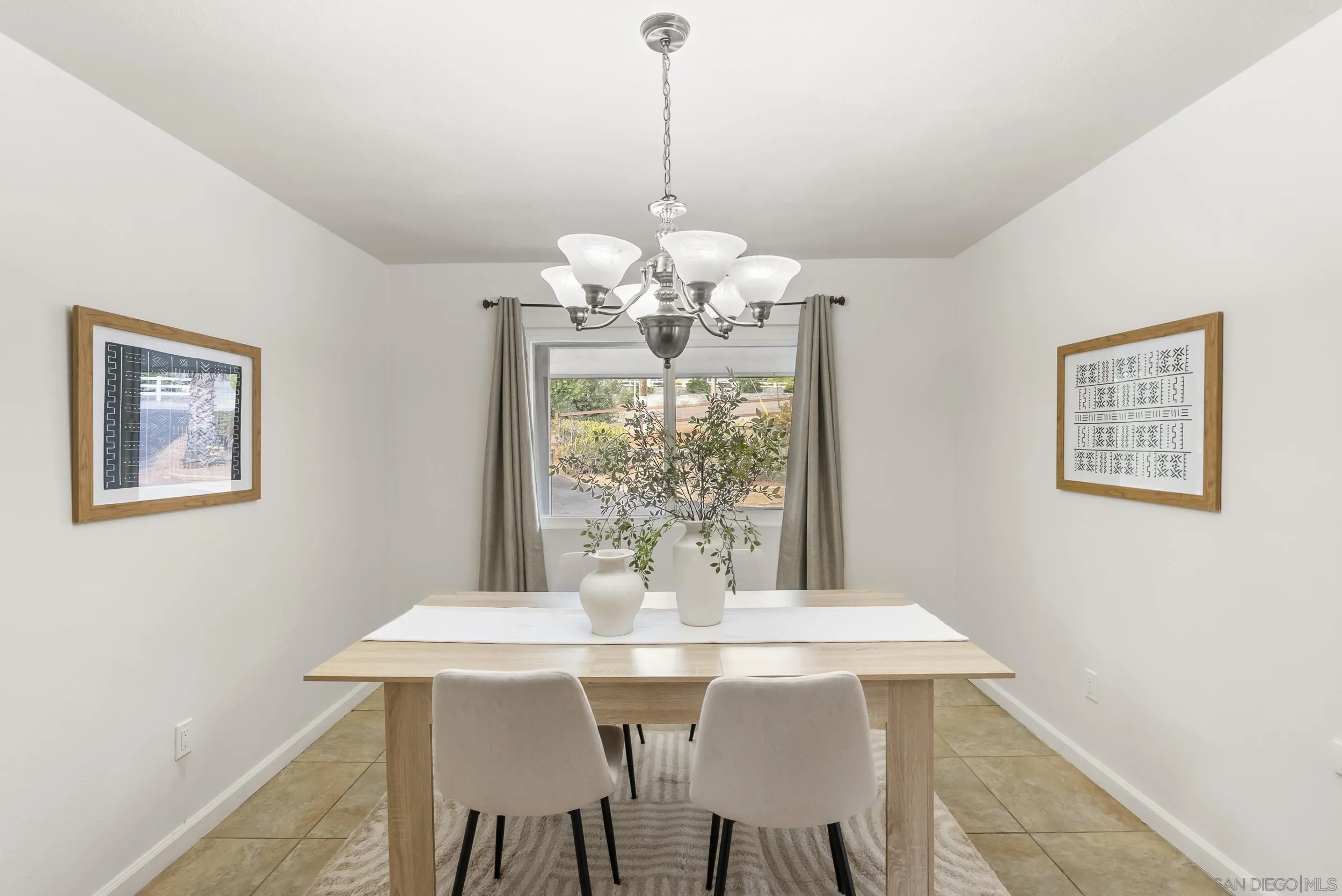 1429 Midway Drive Alpine, CA 91901 - Photo 23 of 42 a view of a dining room with furniture and chandelier