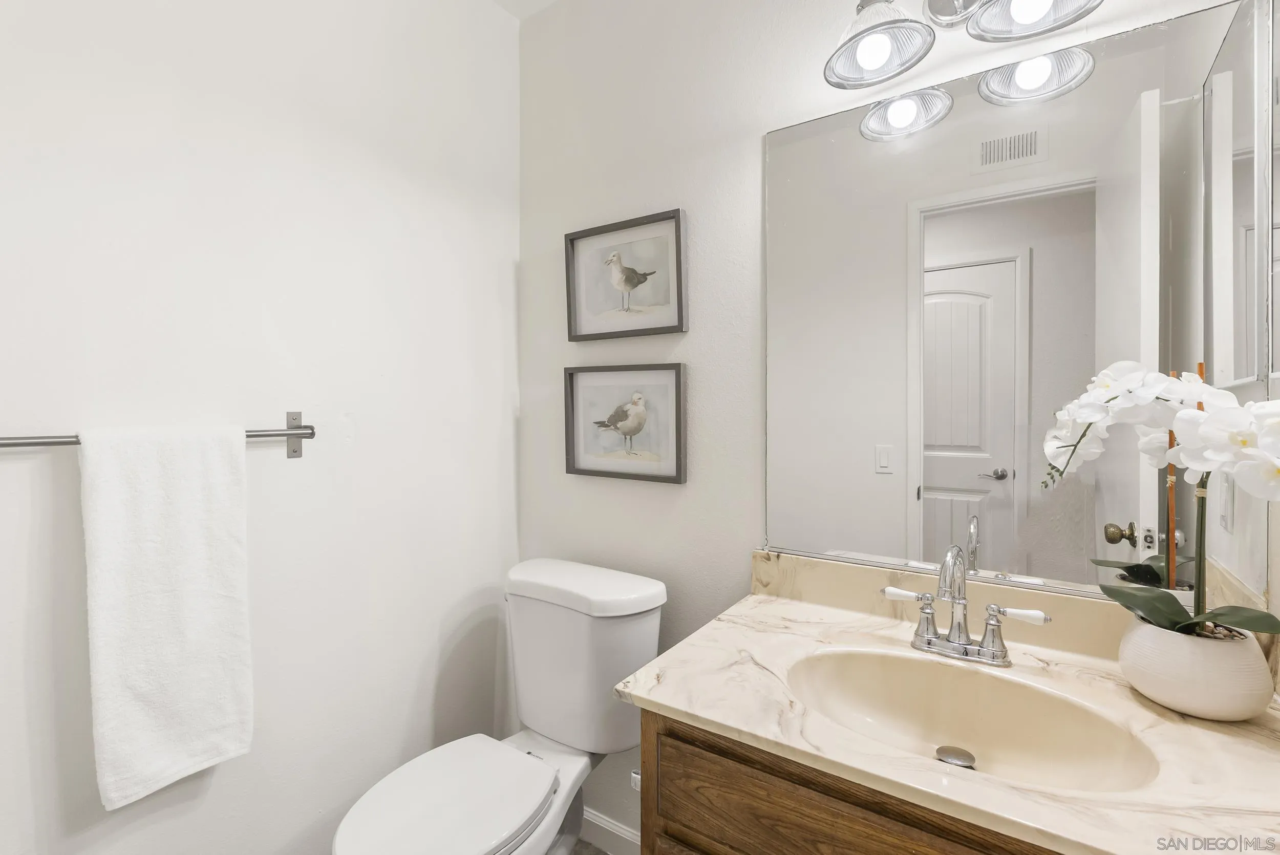 1429 Midway Drive Alpine, CA 91901 - Photo 25 of 42 a bathroom with a sink vanity mirror and toilet