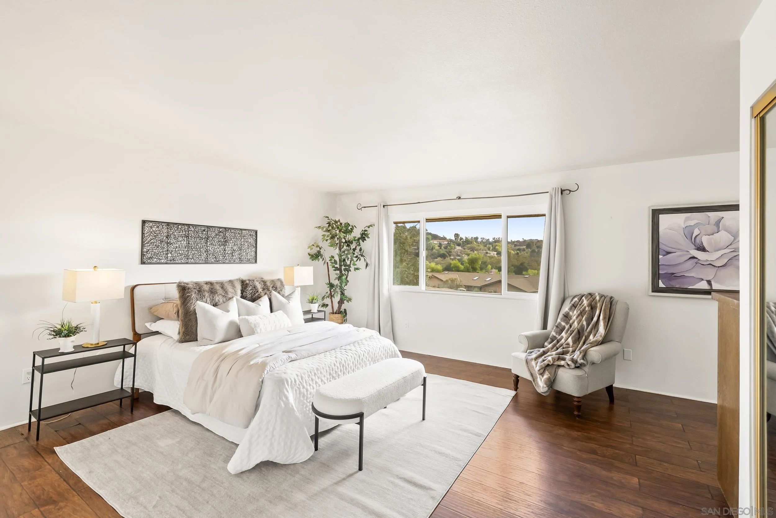 1429 Midway Drive Alpine, CA 91901 - Photo 26 of 42 a bedroom with a bed and a large window