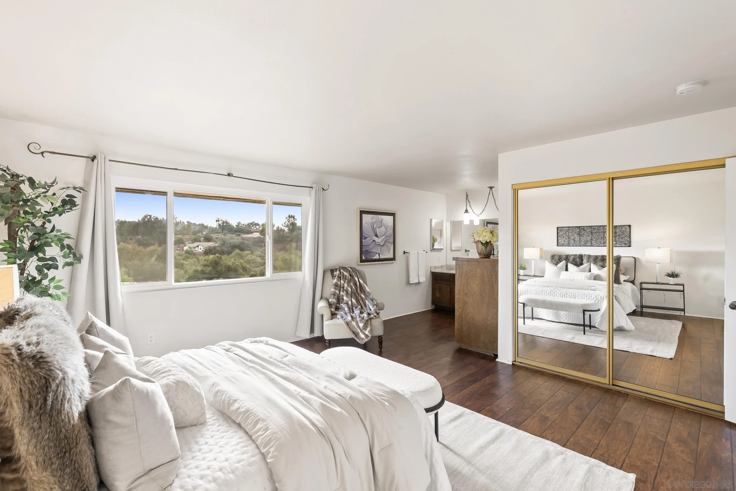 1429 Midway Drive Alpine, CA 91901 - Photo 27 of 42 a bedroom with a large bed and a large window