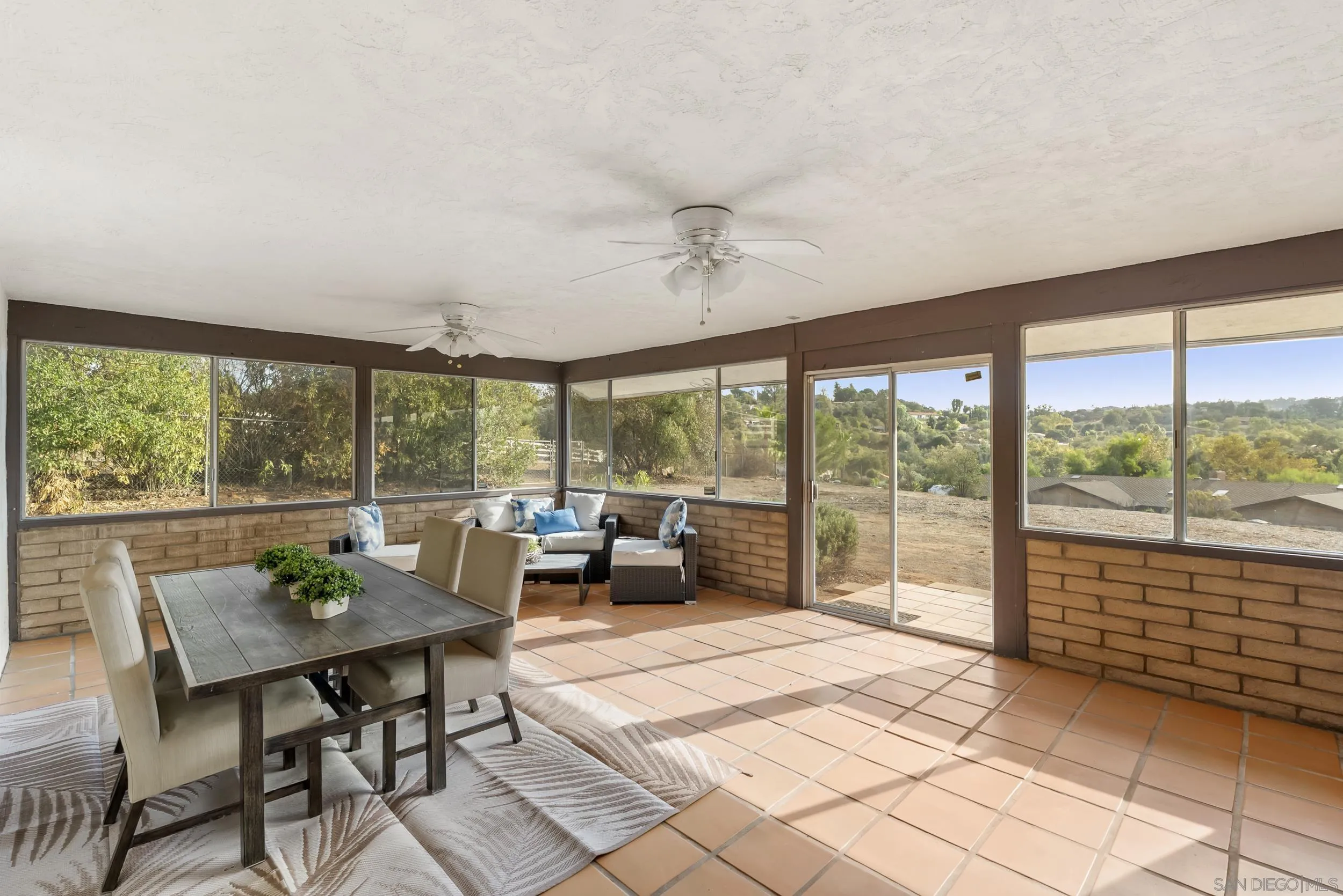 1429 Midway Drive Alpine, CA 91901 - Photo 33 of 42 a living room with furniture and a floor to ceiling window